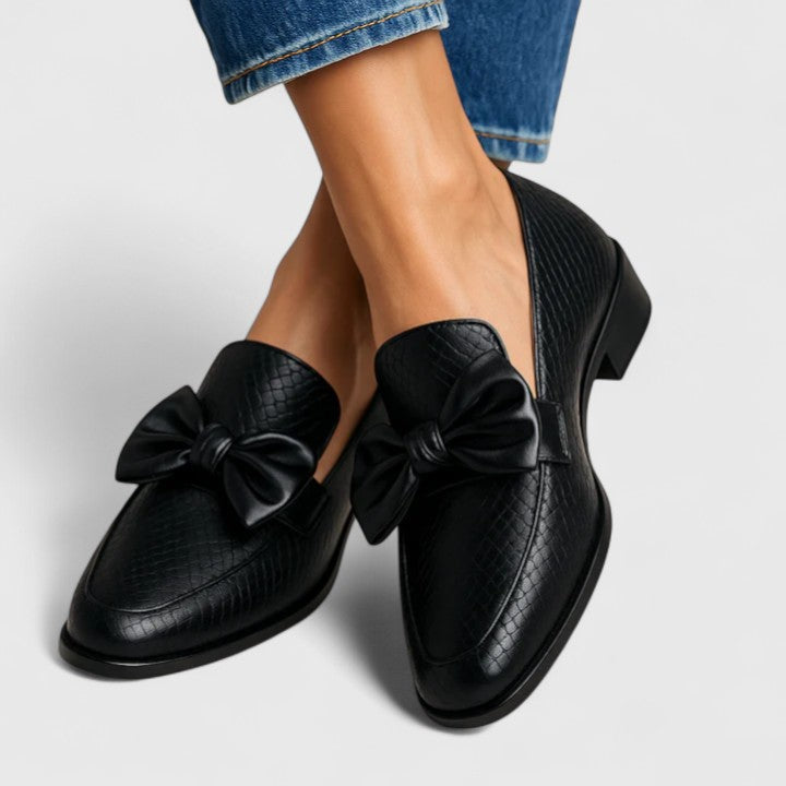 Black luxury loafers with bow detail